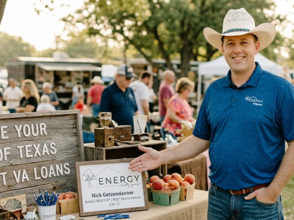 Nick Getzendanner, Broker at Energy Realty Group, hosting a real estate booth at Weatherford First Monday Trade Days in Heritage Park, promoting VA loans and Texas acreage.