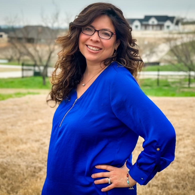 Gabby Getzendanner, REALTOR® with Energy Realty Group, smiling outdoors in Parker County, serving home buyers and sellers in Aledo, Weatherford, and Fort Worth, Texas.
